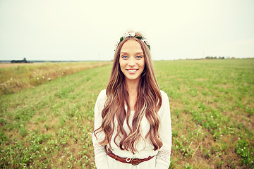 Image showing smiling young hippie woman on cereal field