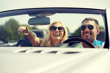 Image showing happy man and woman driving in cabriolet car