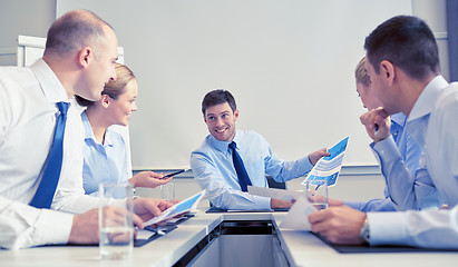 Image showing group of smiling businesspeople meeting in office