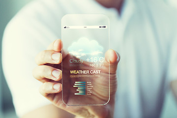 Image showing close up of hand with weather cast on smartphone