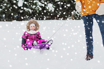 Image showing happy little kid on sled outdoors in winter