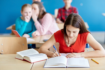 Image showing students gossiping behind classmate back at school