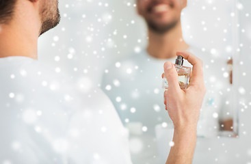 Image showing close up of man perfuming with perfume at bathroom