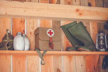 Image showing Wooden shelfe with retro surival kit