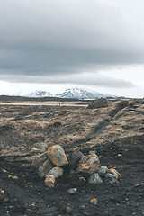 Image showing Cloudy weather over a rocky landscape