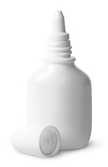 Image showing White nasal spray cap beside