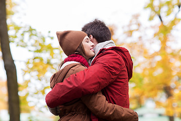 Image showing happy young couple hugging in autumn park