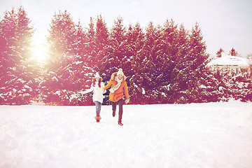 Image showing happy couple running in winter snow