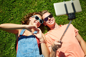 Image showing happy couple taking selfie on smartphone at summer