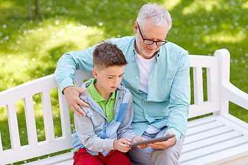 Image showing grandfather and boy with tablet pc at summer park