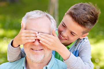 Image showing grandfather and grandson playing at summer park