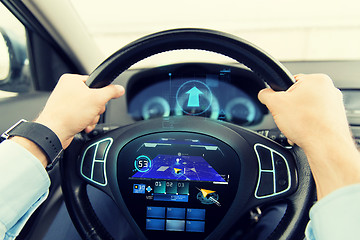 Image showing close up of man driving car with gps navigator