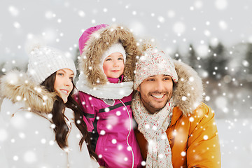 Image showing happy family with child in winter clothes outdoors