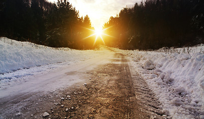 Image showing winter road in rural areas at sunset