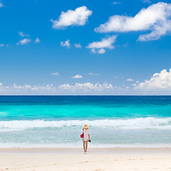 Image showing Woman enjoying picture perfect beach on Mahe Island, Seychelles.