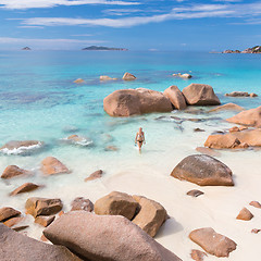 Image showing Woman enjoying Anse Lazio picture perfect beach on Praslin Island, Seychelles.