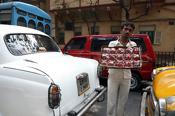 Image showing Streets of Kolkata. Street vendors selling strawberries