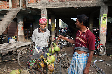 Image showing Selling a coconut on  market in Kumrokhali, West Bengal, India