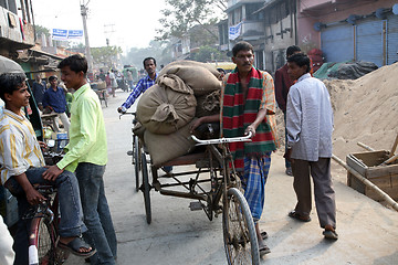 Image showing Man drives his goods to market in Kumrokhali, West Bengal, India 