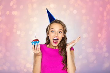 Image showing happy woman or teen girl with birthday cupcake