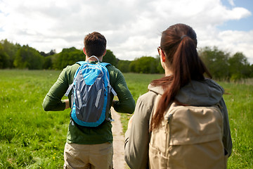 Image showing close up of couple with backpacks hiking outdoors