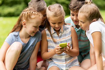 Image showing kids or friends with smartphone in summer park