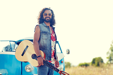 Image showing hippie man with guitar over minivan car outdoor