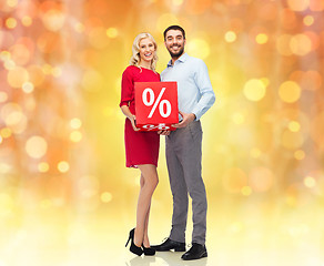 Image showing happy couple with red sale sign