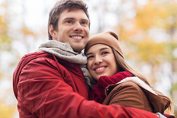 Image showing happy young couple hugging in autumn park