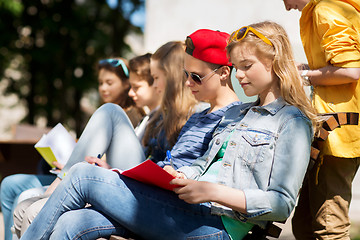 Image showing group of students with notebooks at school yard