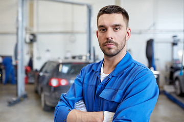 Image showing auto mechanic man or smith at car workshop