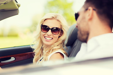 Image showing happy man and woman driving in cabriolet car