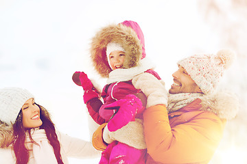 Image showing happy family with child in winter clothes outdoors