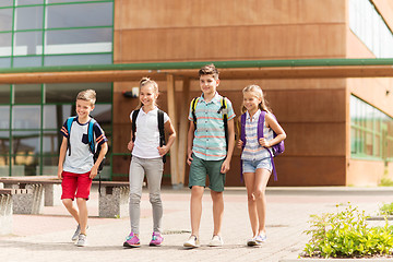 Image showing group of happy elementary school students walking