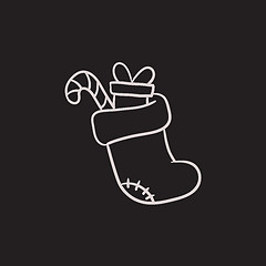 Image showing Christmas boot with gift and candy sketch icon.