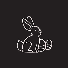 Image showing Easter bunny with eggs sketch icon.