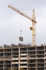 Image showing Crane raised formwork on construction of multi-storey residential building