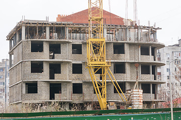 Image showing Abandoned building a house, next to the house is abandoned crane