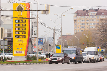 Image showing Anapa, Russia - November 16, 2016: Refills Stand oil company Rosneft with prices as of November 2016 in the Krasnodar region, near cars moving on urban road