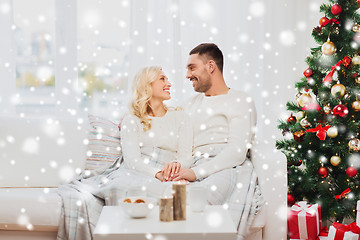 Image showing happy couple at home with christmas tree