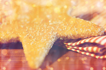 Image showing close up of star gingerbread cookie and towel