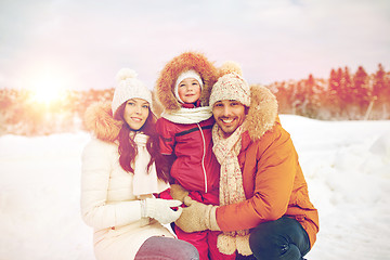 Image showing happy family with child in winter clothes outdoors