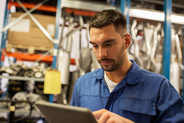 Image showing auto mechanic or smith with tablet pc at workshop