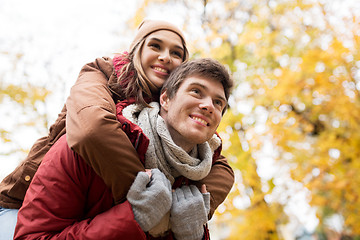 Image showing happy young couple having fun in autumn park