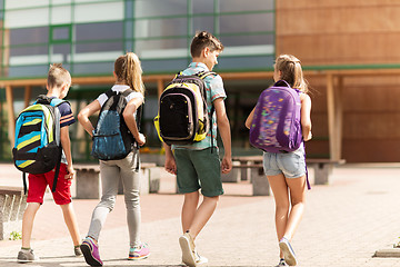 Image showing group of happy elementary school students walking