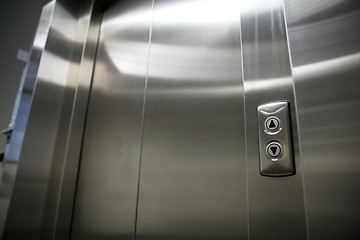 Image showing elevator or lift closed metal doors and buttons