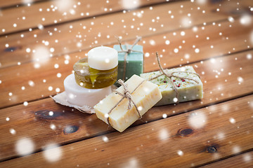 Image showing handmade soap bars on wood