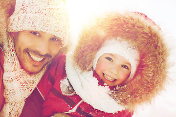 Image showing happy family in winter clothes outdoors