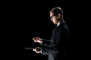 Image showing close up of businessman with transparent tablet pc