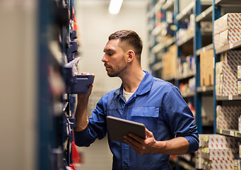 Image showing auto mechanic or smith with tablet pc at workshop